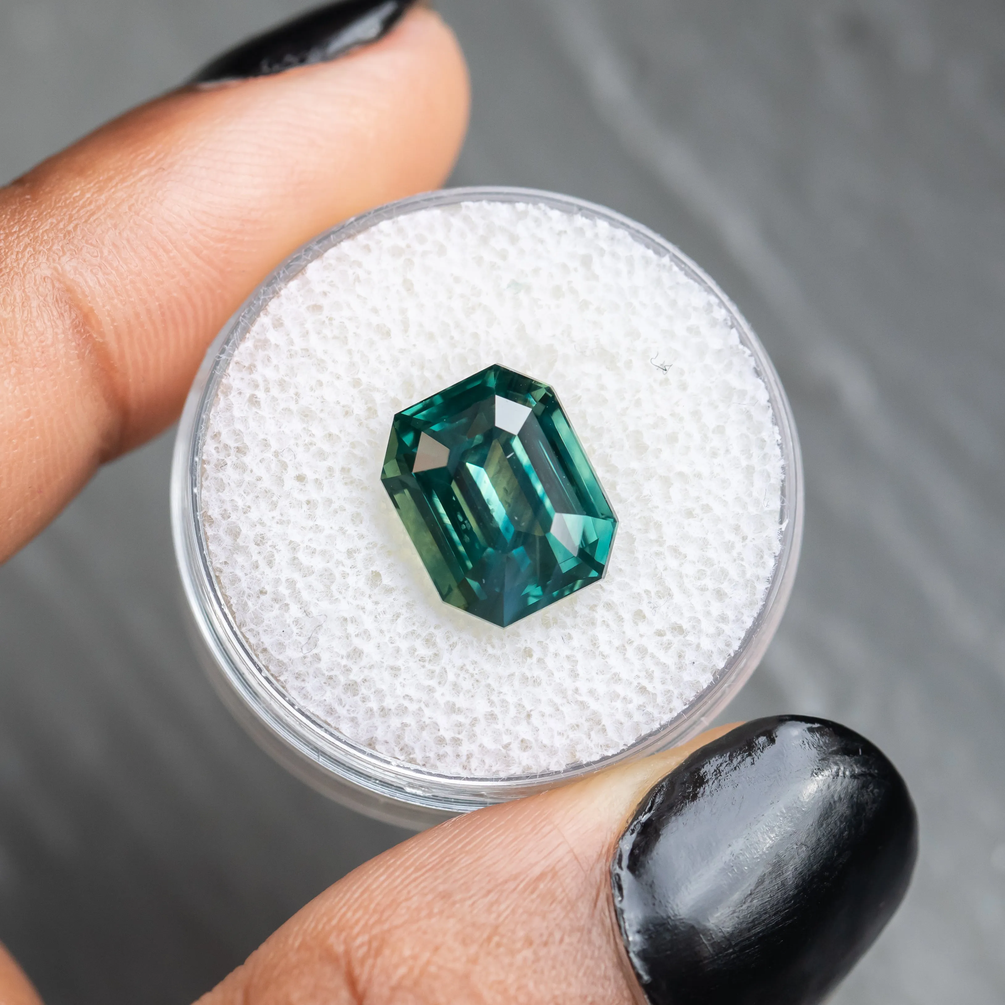 7.08CT EMERALD CUT MADAGASCAR SAPPHIRE, DEEP GREEN TEAL WITH COLOR ZONING, 11.17X9.07X7.07MM