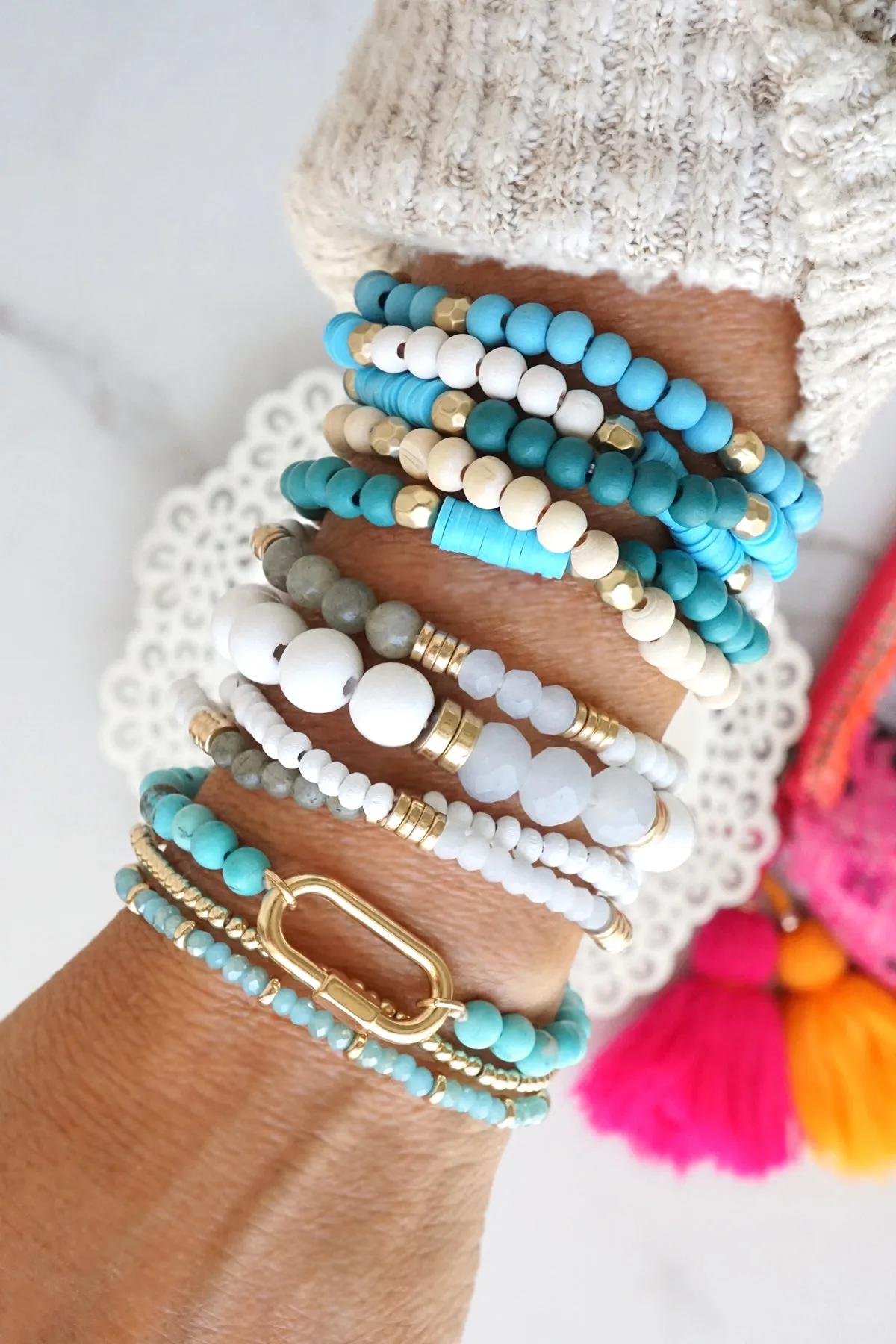 Blue stack of 5 clay and wood beads bracelets in blues and white